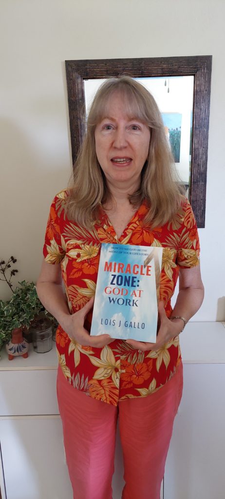 Author Lois Gallo holding Miracle Zone book in paperback edition